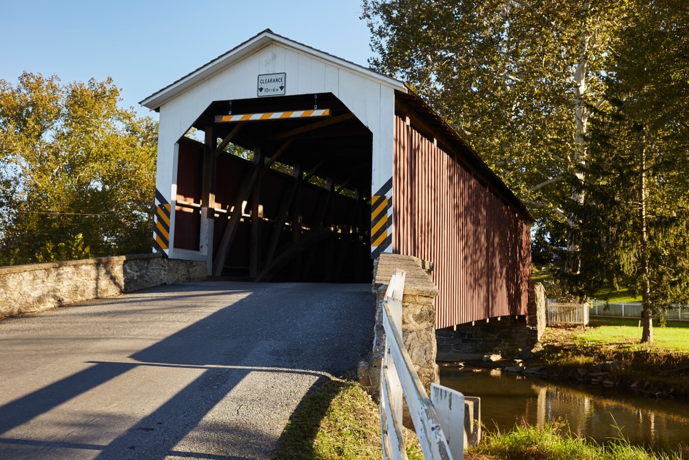 Covered bridge going over a river